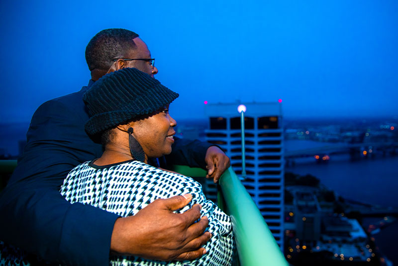 two patients observing the view from the dental implants balcony