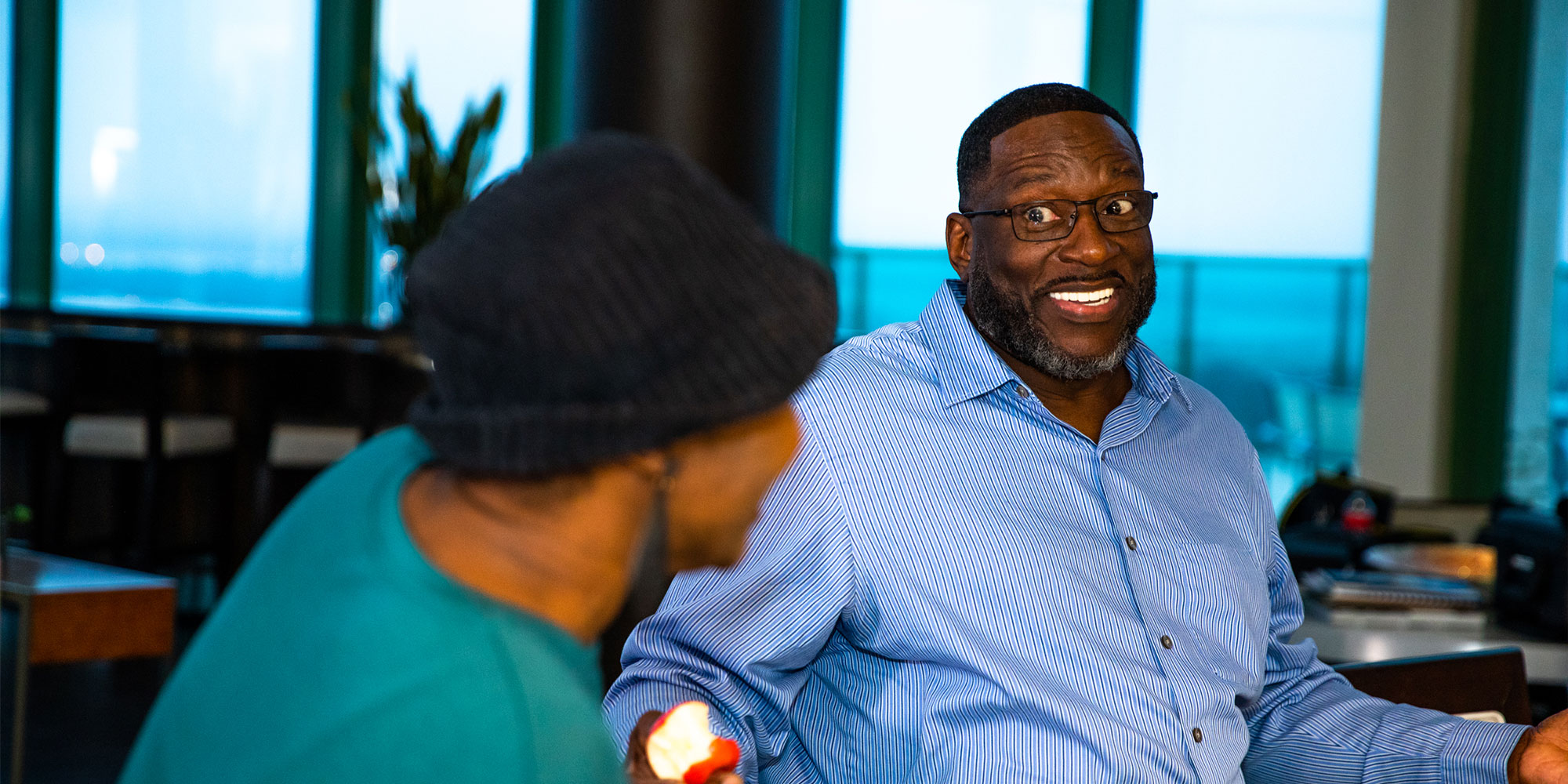 Black male patient and their partner joking around and having a good time