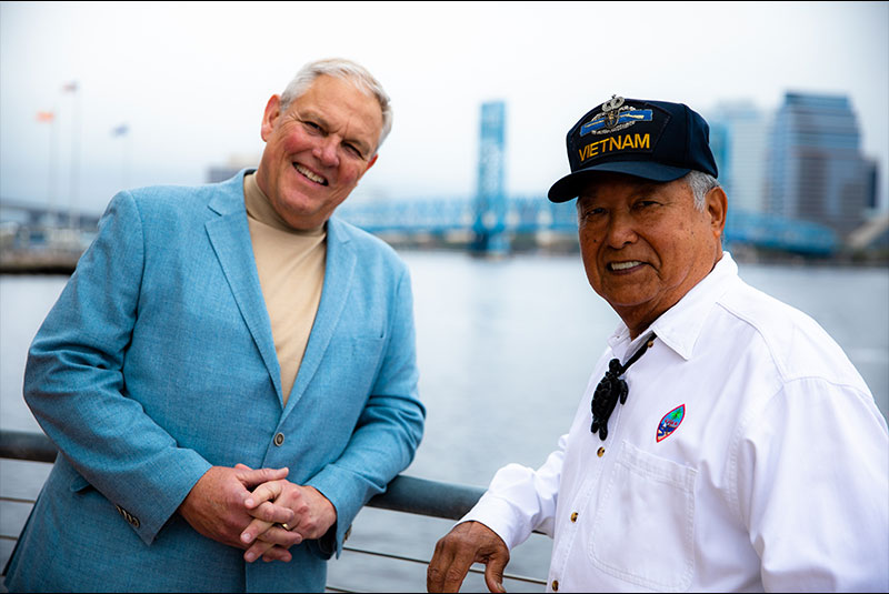 Dr. Spencer with a patient outside of the practice near the bay