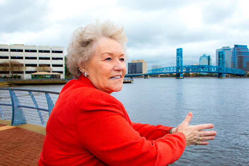 Older female patient looking out into the water of the bay